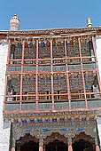 Ladakh - Hemis Gompa, the main monastery halls with the characteristc red painted windows and woden balconies on white washed faades 